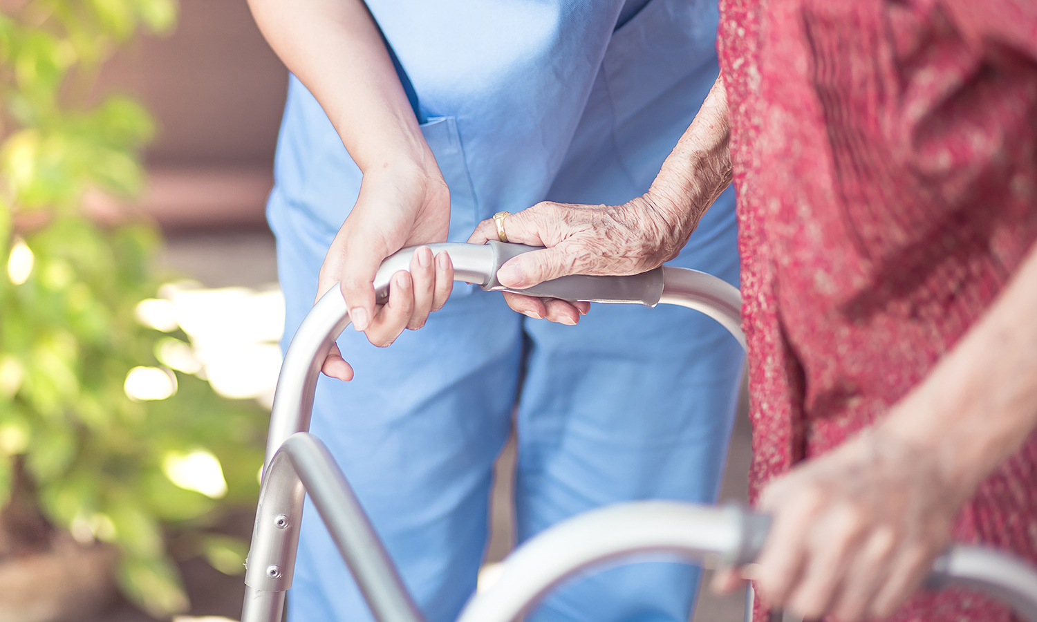 Asian eldery  woman with her caregiver at home. Home care or Elderly care concept.